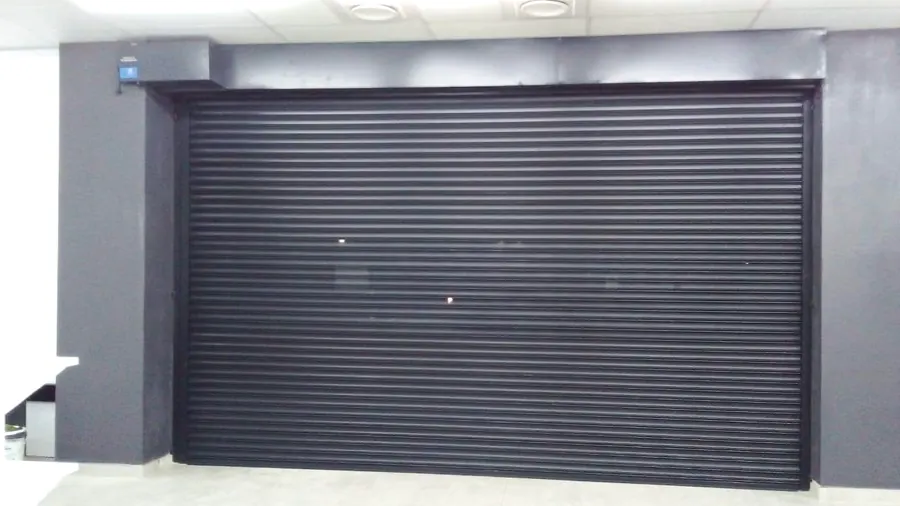 Black roller door on a modern building