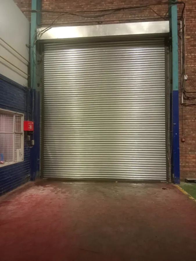 Galvanised roller shutter door in a factory