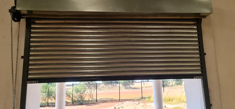 Roller shutter partially open on a serving hatch