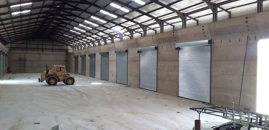 Warehouse interior with multiple galvanised roller shutter doors